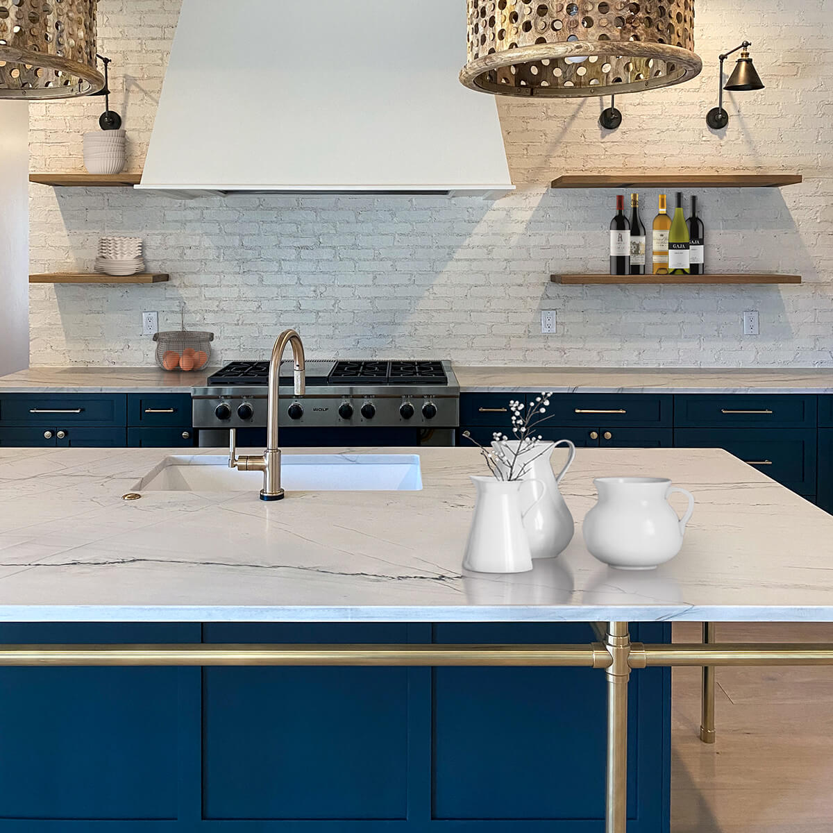 Studio style kitchen island leg system in an un-lacquered aged brass finish  – Chalet Development, Denver CO